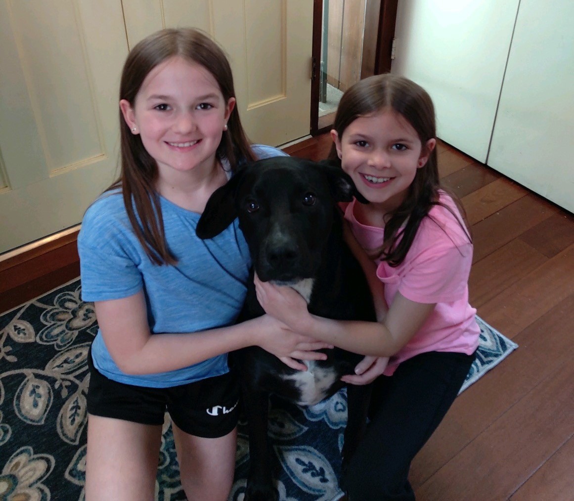 My granddaughters with their dog, Leo